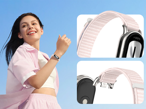 Smartwatch with light pink woven band. Close-up images show band attachment to watch body and textured fabric strap with metal clasp.