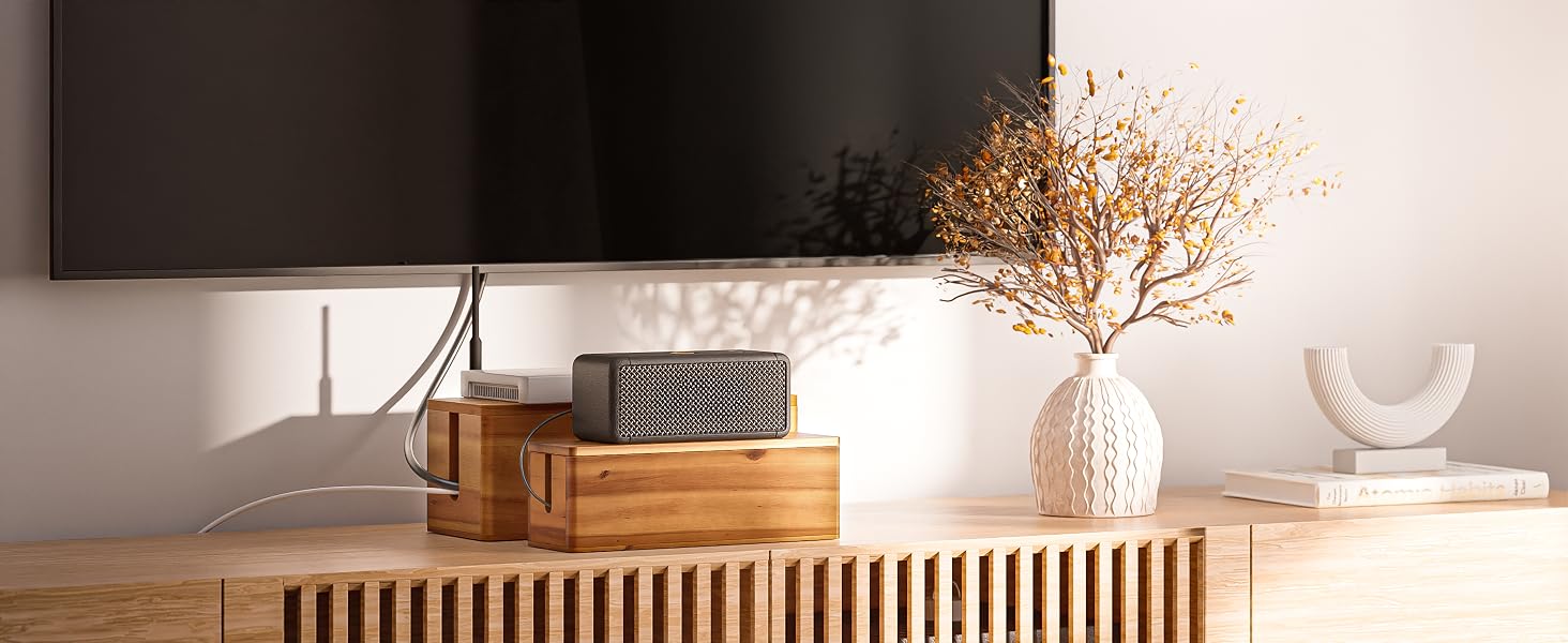 small and large cable box side by side under TV