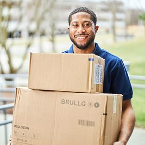Delivery man holding boxes of McKesson products