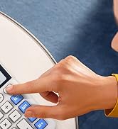 a woman using a calculator to type on a table.
