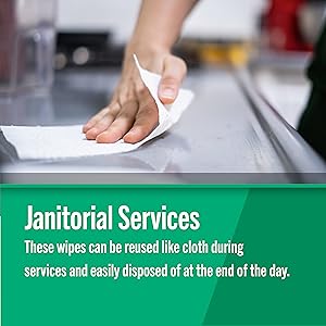 Foodservice Reusable Paper Towels in pink line pattern being used by a janitor to clean up a spill
