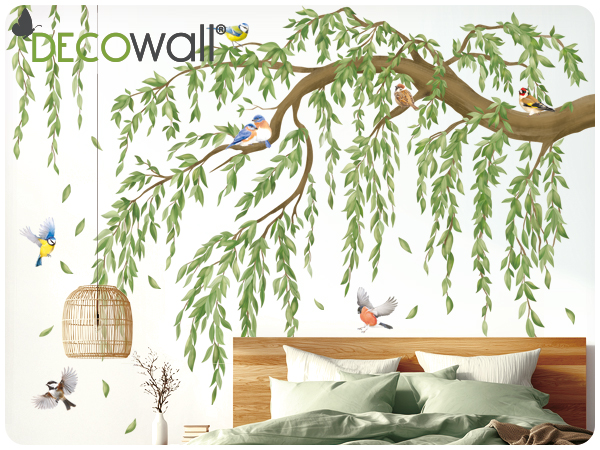 Text reads 'DECOWALL'. Decorative wall decal featuring willow tree branches with hanging birdcages and flying birds in natural green and brown tones.