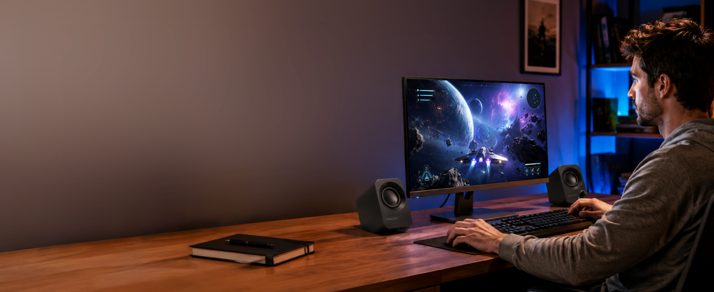 Man using FUNLOGY Speaker Plus at a home PC desk for gaming.