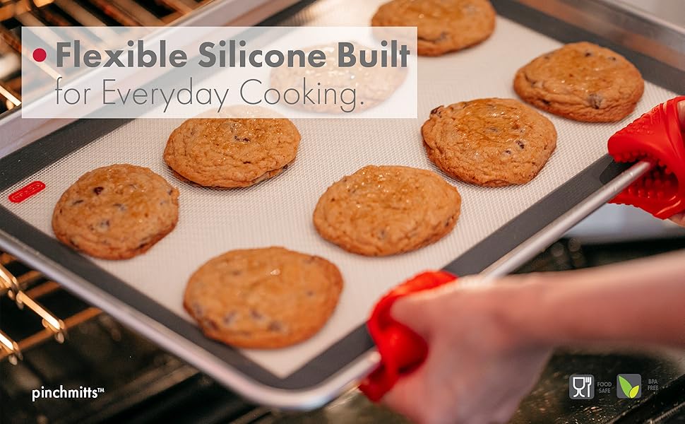 silicone mitts getting baking pan out of the oven