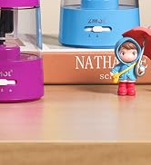 Text reads 'NATHA'. Blue and pink cylindrical containers on surface with small decorative figure in red outfit.