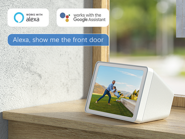 Smart display device showing home security camera feed, compatible with Alexa and Google Assistant, displayed on white countertop.