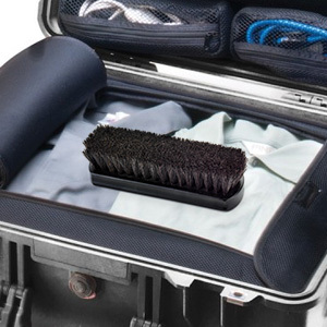 black horsehair boot brush in luggage ready to go on a quick trip