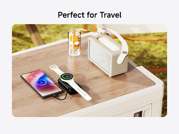 Travel-friendly setup on wooden surface with smartphone, smartwatch, portable speaker, and white carrying case. Text reads 'Perfect for Travel'.