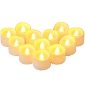 Array of flameless LED tealight candles arranged in rows, showing warm yellow glow against white plastic bases.