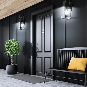 Medium shot of entryway at night and outdoor lights turned on for peace of mind thanks to schedules.