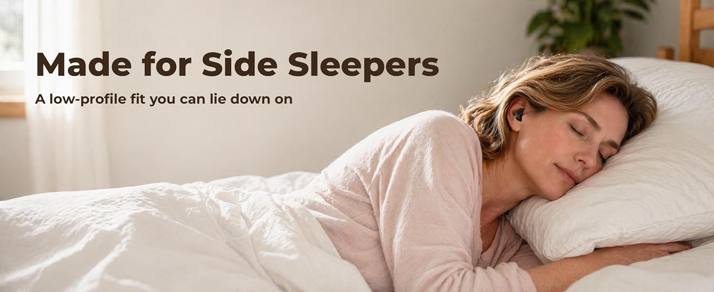 Woman sleeping on her side in bed wearing a tiny low-profile wireless earbud