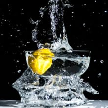 lemon splashing in water to represent toilet splashing