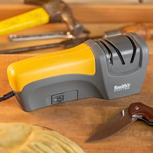 handheld sharpener displayed with tools and knives electric and manual sharpening slots