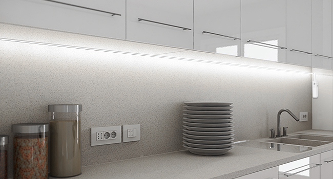a kitchen with white cabinets and a white counter.