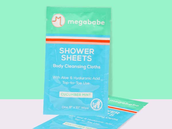 Megababe shower sheets on a green background.