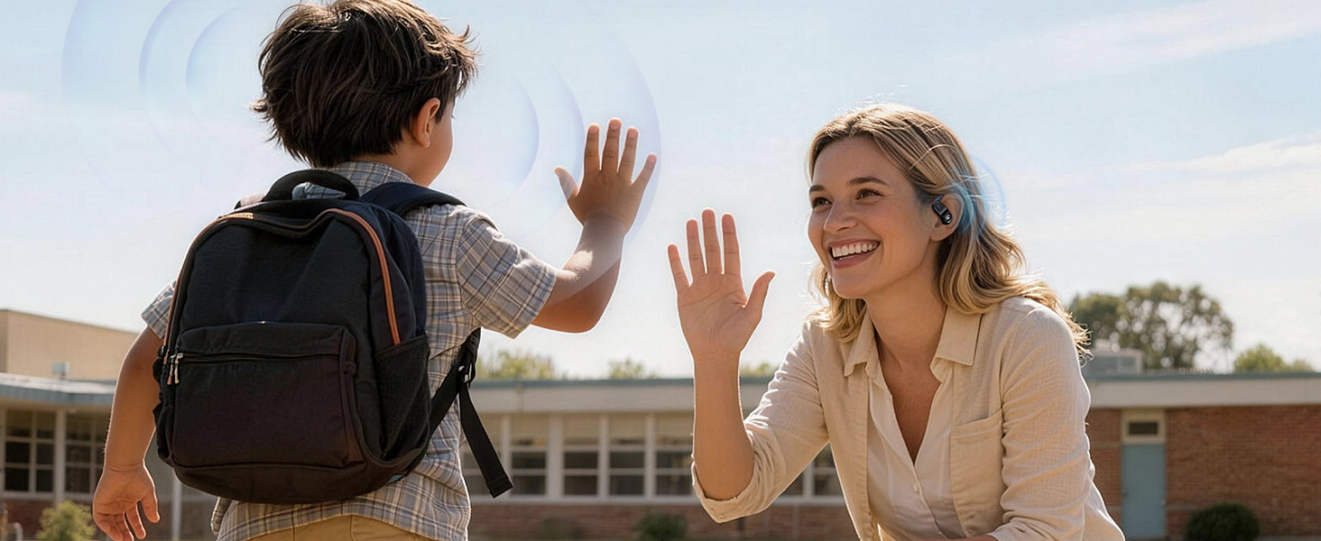 Two people high-fiving each other outdoors in what appears to be a campus or educational setting.