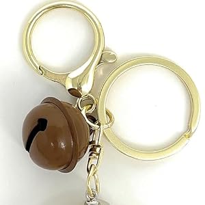 Gold keychain ring and cute bell detail for elephant bag charms.