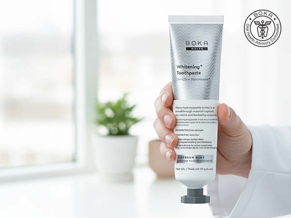 with hand holding whitening toothpaste
