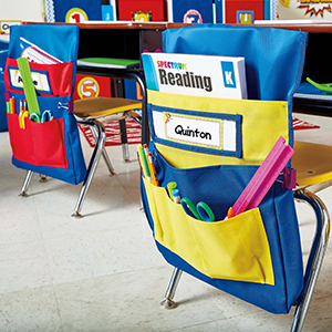 chairback buddy in a classroom setting showing the pckets with items inside