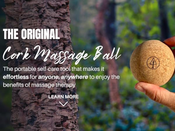 Hand holding a Rawlogy cork massage ball in a forest