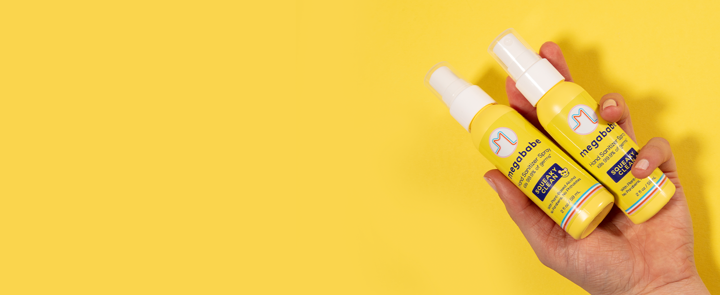 Hand sanitizer spray on yellow background.