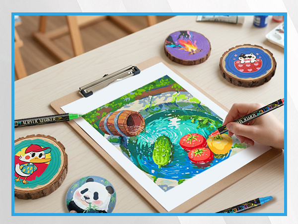 Art supplies setup with clipboard holding colorful artwork in progress, surrounded by decorated circular coasters or badges featuring cartoon characters.