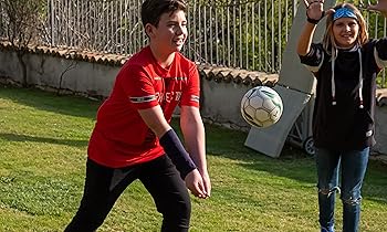 boy playing sport with arm weight