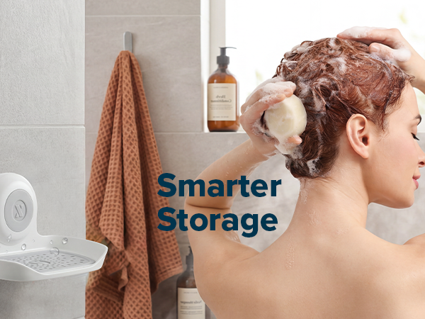 Image showing a woman attaching and removing the soap saver from a tile wall