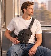 Man seated on a subway wearing a black sling bag across his chest