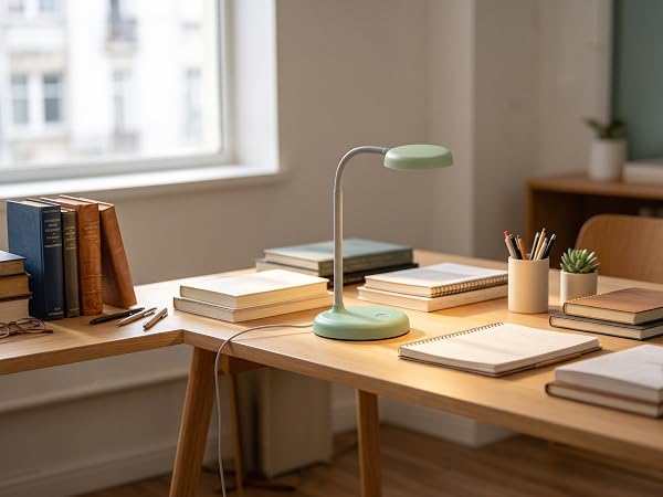 lamp on a desk piled of books
