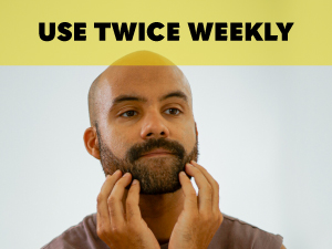 Guy touching beard