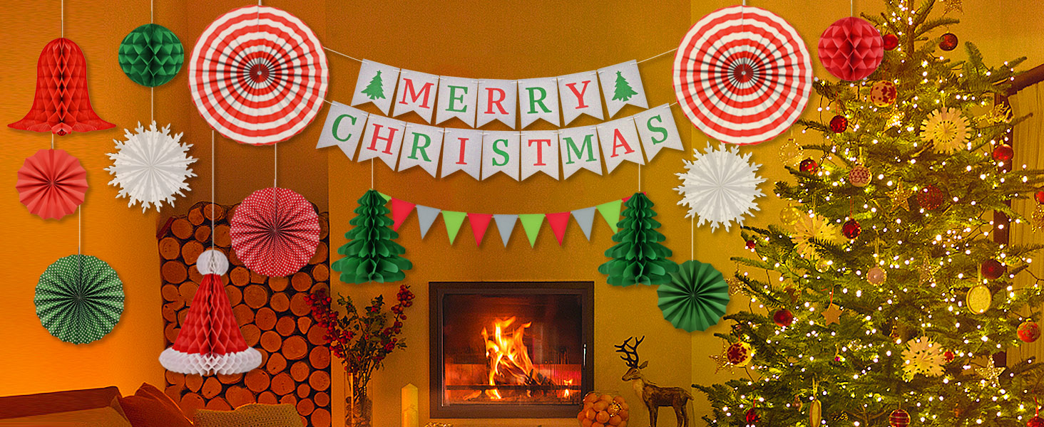 Festive Christmas scene with decorated tree, fireplace, and colorful paper decorations including 'Merry Christmas' banner on orange background.