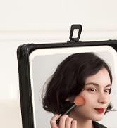 Close-up of a black-framed smartphone or device holder with adjustable mounting clip visible.