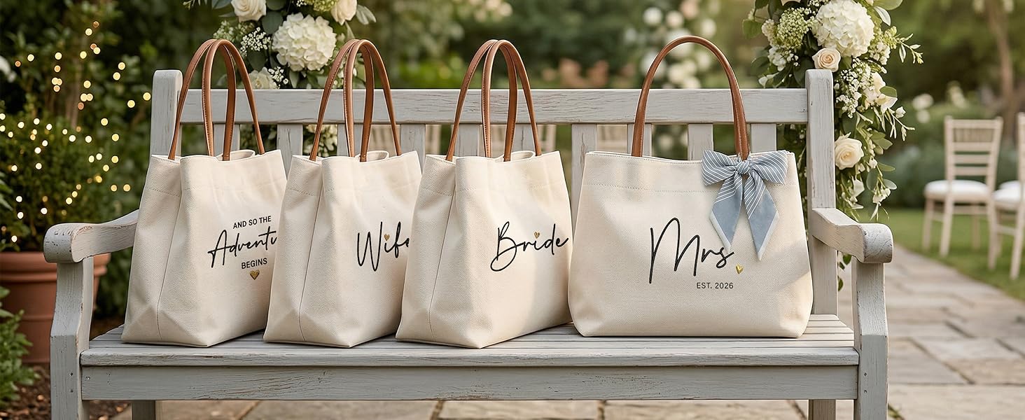 Four high quality personalized wedding canvas totes displayed on a garden bench as luxury gifts.