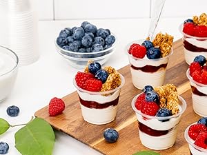 Mini parafaits in small plastic clear cups.