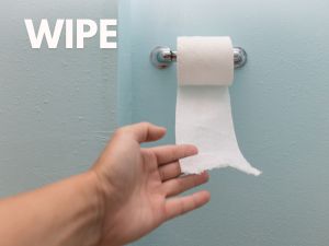 hand pulling toilet paper from roll