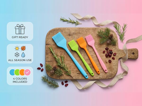 Four colorful silicone basting brushes on wooden board with festive decor and gift ready badges
