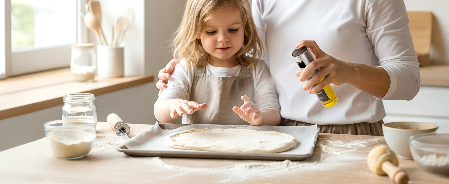 Overhead view of baking scene with rolling pin and hands sprinkling ingredients on white surface with measuring cups nearby.