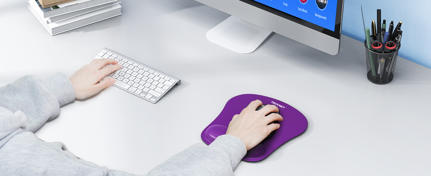 a person using a mouse on a desk