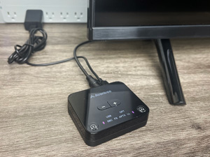 Avantree Audikast plugged in to a power source and TV.