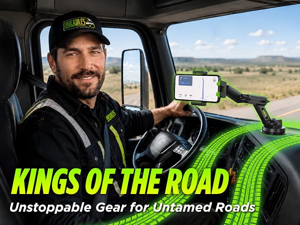 Truck driver using Truckules phone mount with GPS inside semi truck cab