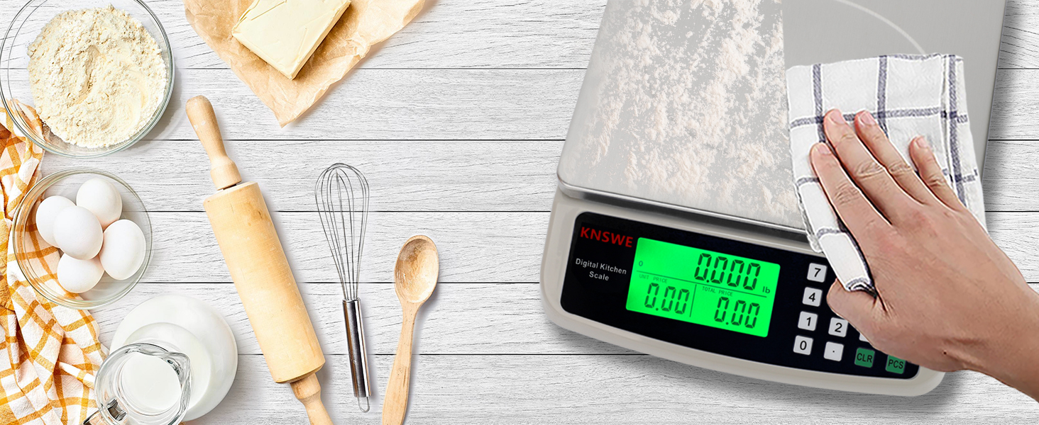 a kitchen scale sitting on a table next to a wooden spoon and a spoon.