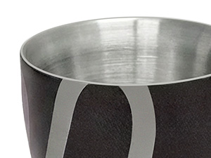 Close-up views of a stainless steel cooking pot showing three metal handles attached to the sides with rivets. Interior shows polished metal surface.