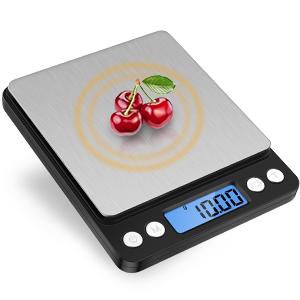 a digital scale with a picture of cherries on it.