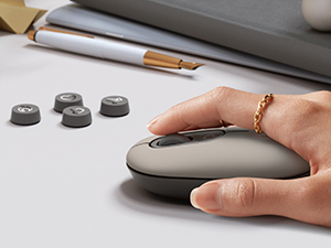 zoom on a woman hand using pop mouse mist wireless compact purple mouse