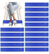Composition showing legs in jeans and sneakers on stairs, with repeating bright blue rectangular strips arranged in two vertical columns below.