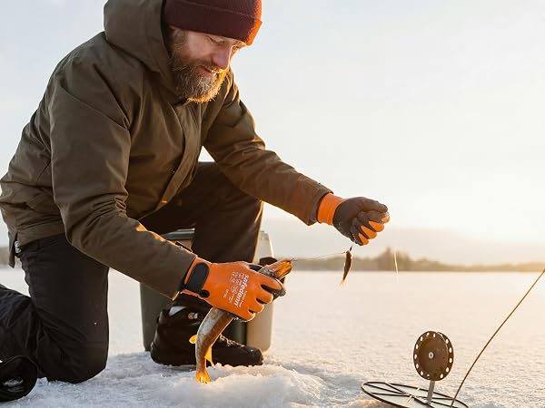 Fisherman holding a rod while ice fishing wearing Safedenn waterproof thermal gloves.