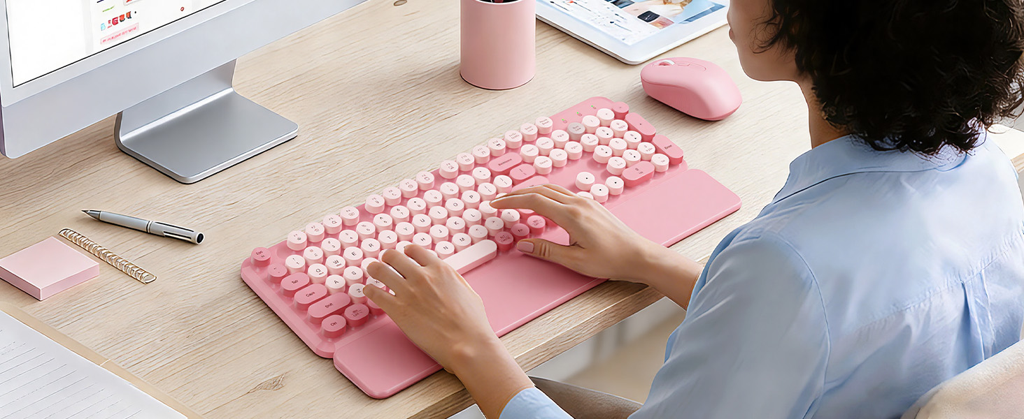 Office worker typing on a lavender retro round-keycap keyboard with wrist rest, with matching mouse
