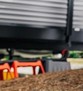 Camco RhinoFLEX rv sewer hose nestled in the Camco sewer hose support kit