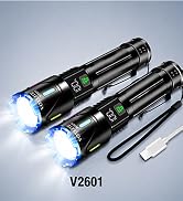 Text reads "V2601". Two black metal flashlights with bright blue LED beam output, shown with charging cable and adjustment ring controls.